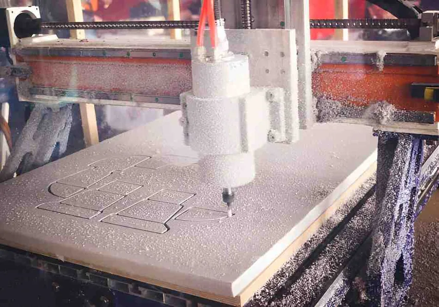 Existing process image showing a router cutting profiles in a foam sheet